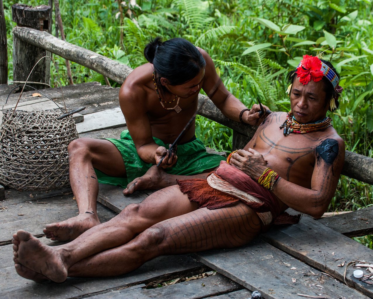 traditional tattooing process of mentawai people