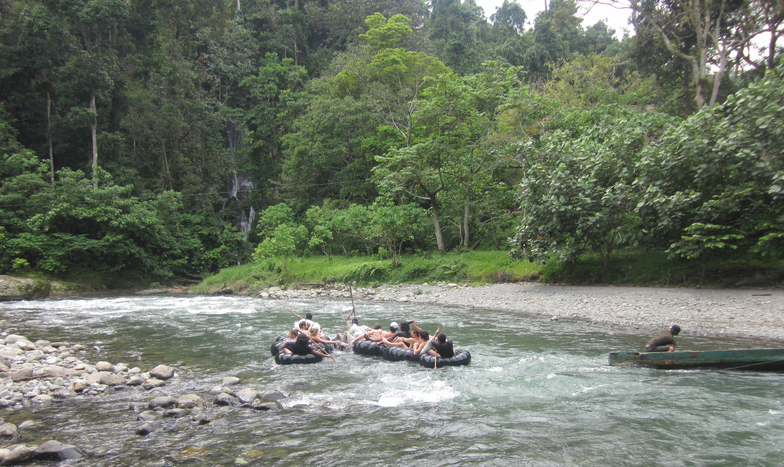 cruising the rushing river of tangkahan